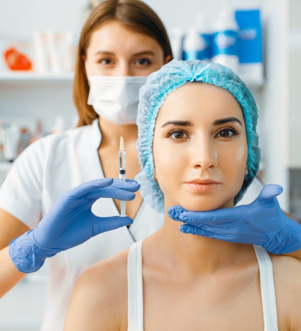 cosmetician-holds-syringe-with-injection-of-botox.jpg